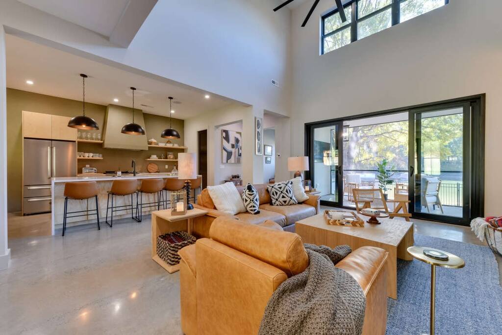 A double-height living room opening to the lake at The Retreat at Lake Norman